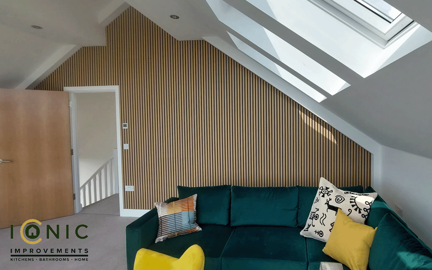 Acoustic wooden panel installed by Iconic Improvements on a wall, enhancing sound absorption in a modern interior.